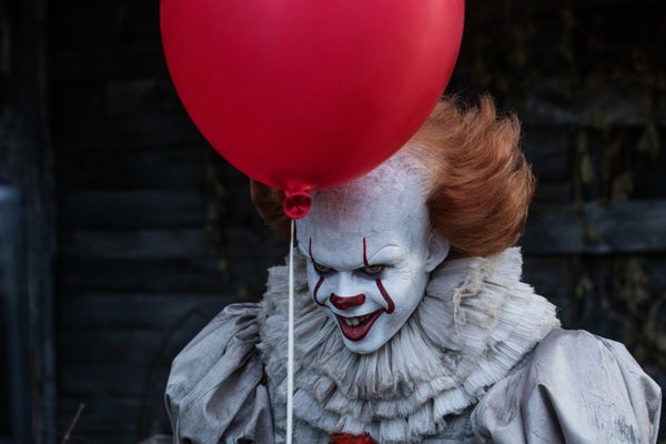 Clown with red balloon